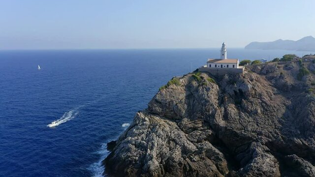 Aerial view, flight at  lighthouse Far de Capdepera with cliffs, Cala Ratjada, Mallorca, Balearic Islands, Spain