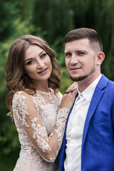 Fototapeta premium Beautiful young couple. Wedding. A family