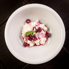 delicious cottage cheese dessert with cherry jam and mint
