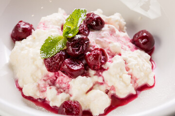 delicious cottage cheese dessert with cherry jam and mint