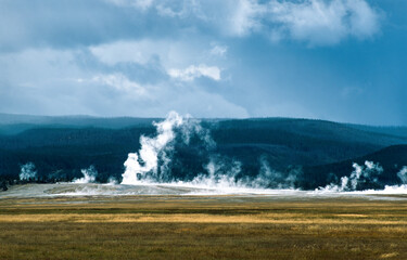 Fototapeta na wymiar Geyser eruption in Yellowstone National Park, USA