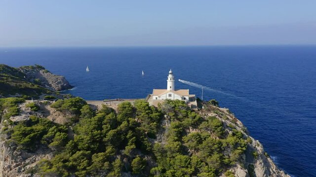 Aerial view, flight at  lighthouse Far de Capdepera with cliffs, Cala Ratjada, Mallorca, Balearic Islands, Spain