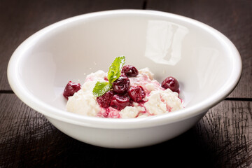delicious cottage cheese dessert with cherry jam and mint