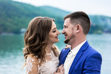 Fototapeta premium Beautiful young couple. Wedding. A family