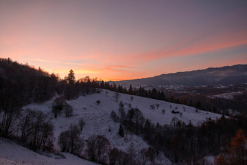 Amazing mountain sunset in winter time
