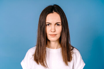 Portrait of sad frown women isolated on blue