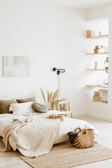 Stylish eco-friendly bedroom interior in beige tones.