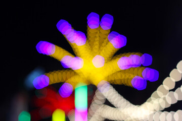 Blurred light from night festival in Chiangmai, Thailand. Blurry brake lights. Colorful bokeh background. Background for happy new year 2021.