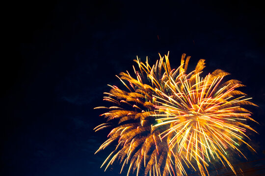 Beautiful fireworks for New Years, Independence Day or other holiday against the background of a dark sky