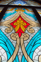 large stained glass window with colored patterned glass