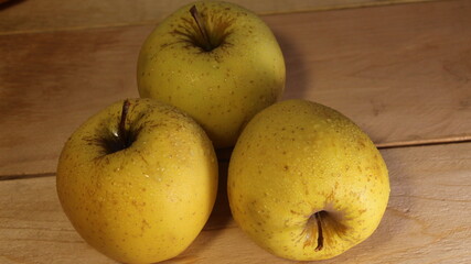 Beautiful yellow-green ripe apples and bananas on a beautiful background