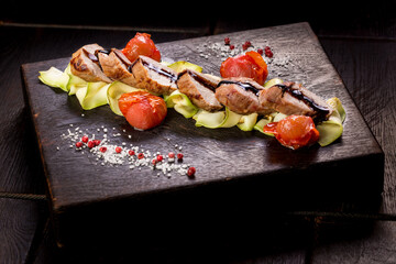 appetizing veal tenderloin with zucchini and tomatoes