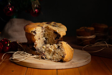 Delicious chocolate panettone for Christmas in dark background.