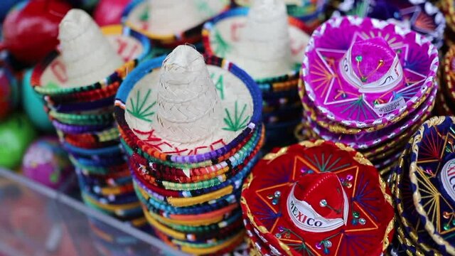 View Spinning Around Souvenirs in Form of Colorful Mexican Sombreros