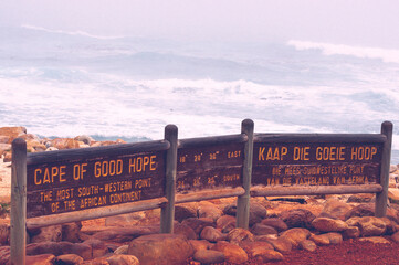 Cape of good hope sign with longitude and latitude coordinates for the most south-western point of...