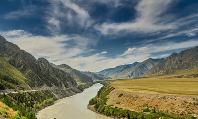 motor road in the mountains along the mountain river