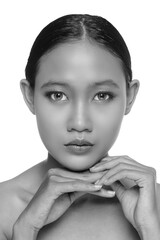 A close up of a beautiful young white girl model in pigtails with blue eyes or blue contact lens and natural makeup (Black and White)