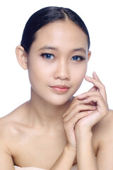 A close up of a beautiful young white girl model in pigtails with blue eyes or blue contact lens and natural makeup