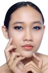 A close up of a beautiful young white girl model in pigtails with blue eyes or blue contact lens and natural makeup