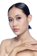 A close up of a beautiful young white girl model in pigtails with blue eyes or blue contact lens and natural makeup