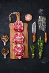 Raw lamb neck on wooden cutting board with herbs and seasoning © boomeart