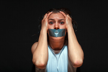 Portrait of a young suffering sad woman with tears in her eyes. Domestic violence, crying,...