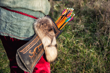 Ancient leather arrow quiver with archery ornament