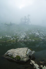 Morning fog at Spiegelsee in Schladming, Austria	