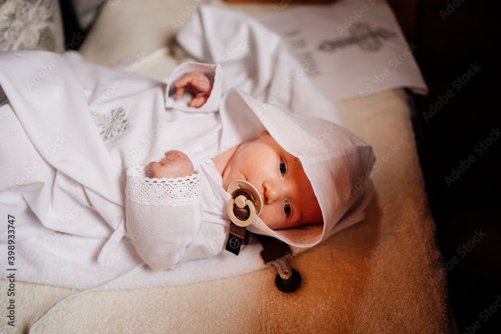 Sticker Confirmation. infant baby at the ritual of baptism in the Orthodox Church.