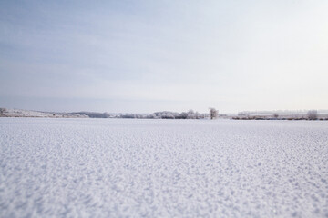 Fototapeta na wymiar winter lake view with snow. frozen lake with winter snow. winter wonderland
