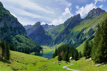 Some Alpstein mountains and Lake Alpsee.