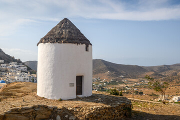 Fototapeta na wymiar The traditional Greek windmill of Ios Island in beautiful Cycladic town of Chora. Greece
