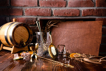 Set of bar or pub accessories with martini cocktail shaker. Set for the bartender Bar spoon, jiger, strainer