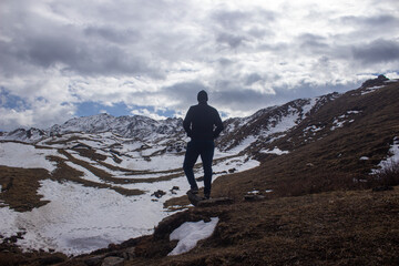 Fototapeta premium hiker on the top of snow-capped mountain