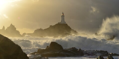 La Corbiere lighthouse, Jersey, U.K. Winter storm around a coastal landmark.