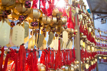 Kowloon, Hong Kong - 02.12.2020 : golden bell with greeting word pray for lucky in Wong Tai Sin Temple