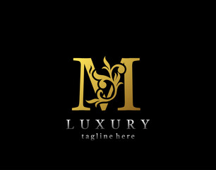 Letter M luxury logo icon, luxury gold flourishes ornament monogram design vector.