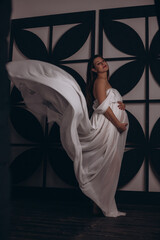 Beautiful pregnant girl in white dress