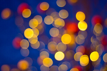 Multicolored bokeh on a dark background. 