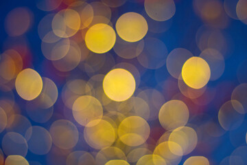 Multicolored bokeh on a dark background. 