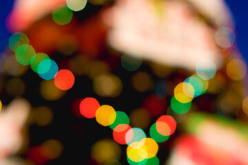 Christmas tree in blurred focus. Bokeh balls of different colors. Christmas, New Year, Christmas Eve.