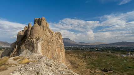 Fototapeta premium Fortress of Van, first built by Urartian Kingdom, the ancient Armenians. The fortification and the town below it was deserted after the Van rebellion and Turkish genocide of Armenians.