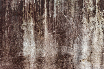 Fototapeta premium Texture of a concrete wall with cracks and scratches which can be used as a background