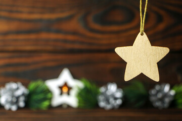 Christmas toy in the shape of a star on a dark background. New year's card. High quality photo