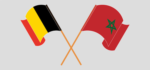 Crossed and waving flags of Belgium and Morocco