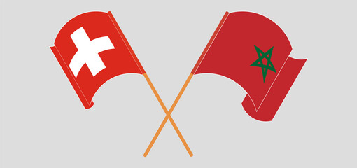 Crossed and waving flags of Switzerland and Morocco