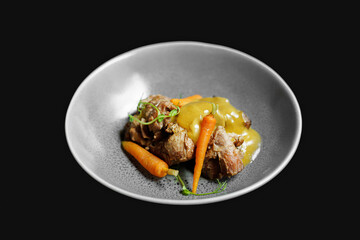 Chef's Dish meat with vegetables on black background
