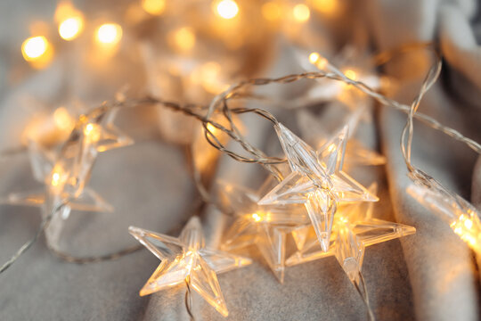 Lovely image of star shaped Christmas lights at home. Christmas and New Year concept.