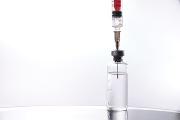 Vaccine and syringe injection. It use for prevention,immunization and treatment from corona virus infection. syringe and vials. Vaccine for coronavirus on white background