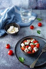 Tomato parsley Feta cheese salad in a bowl